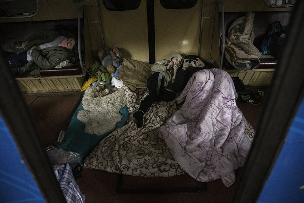 People living in a metro station while seeking shelter from Russian strikes in Kharkiv, Ukraine