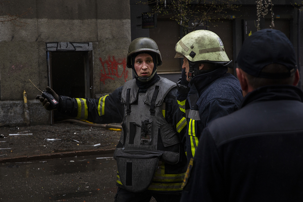 Firemen fighting a fire after Russian shelling of Kharkiv on Easter Sunday