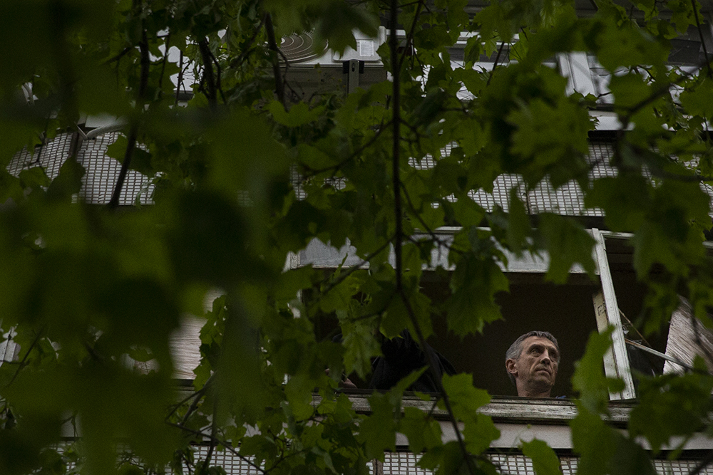 Man with seen through tree