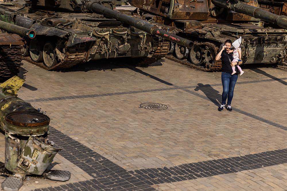 Woman and child at destroyed Russian tank display